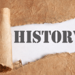 Scroll with "HISTORY" text on aged paper, related to plumbing maintenance tips by Allore's Plumbing Services.