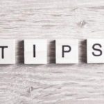 Wooden blocks spelling 'TIPS' for plumbing advice from Allore's Plumbing Services LLC, highlighting practical home solutions.